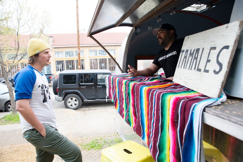 Charles Bratcher (left) places a tamale order from John Hernandez of Casa Masa in the Bishop...