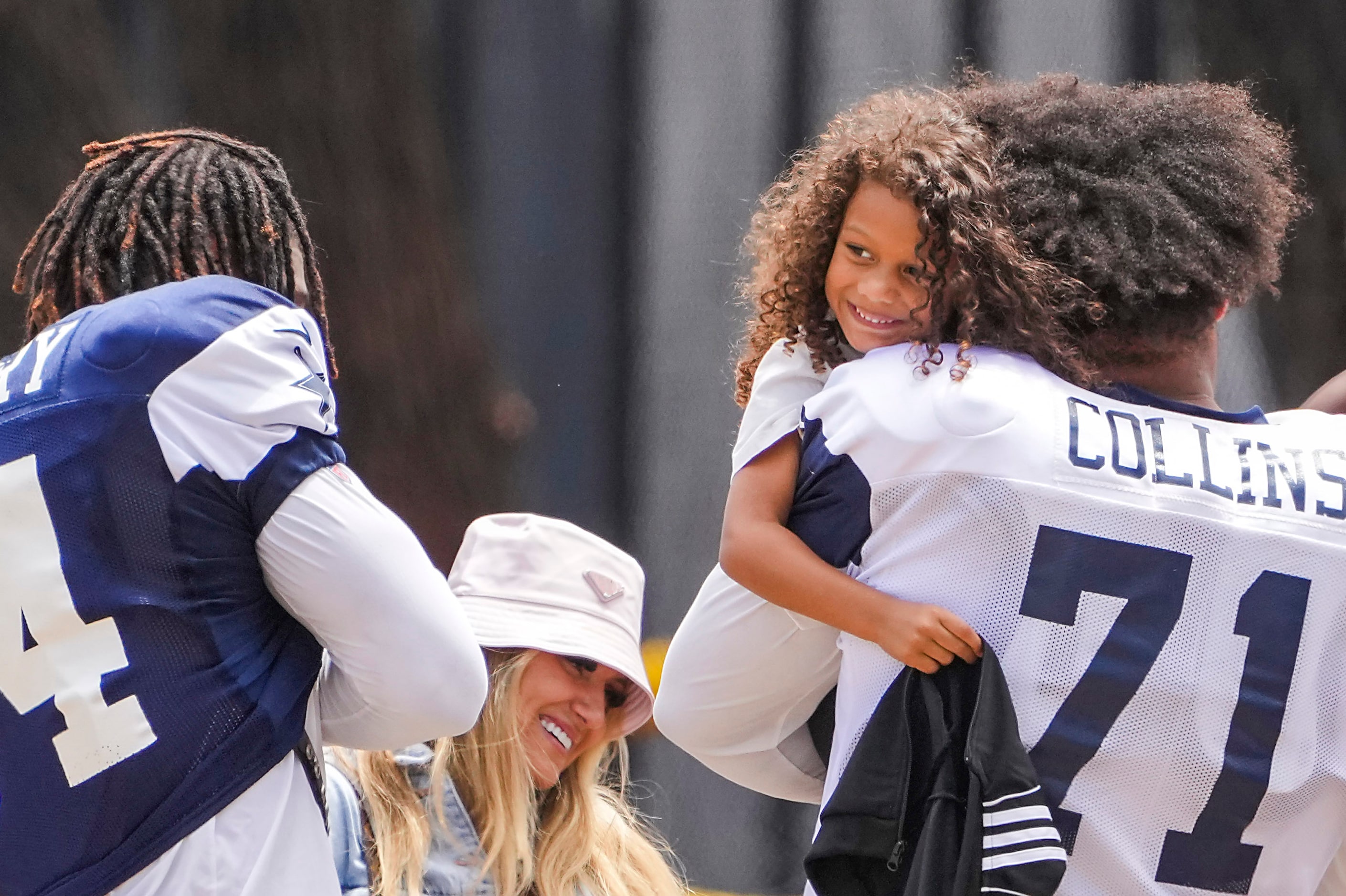 Dallas Cowboys tackle La'el Collins (71) hugs Sophia Gregory, daughter of defensive end...