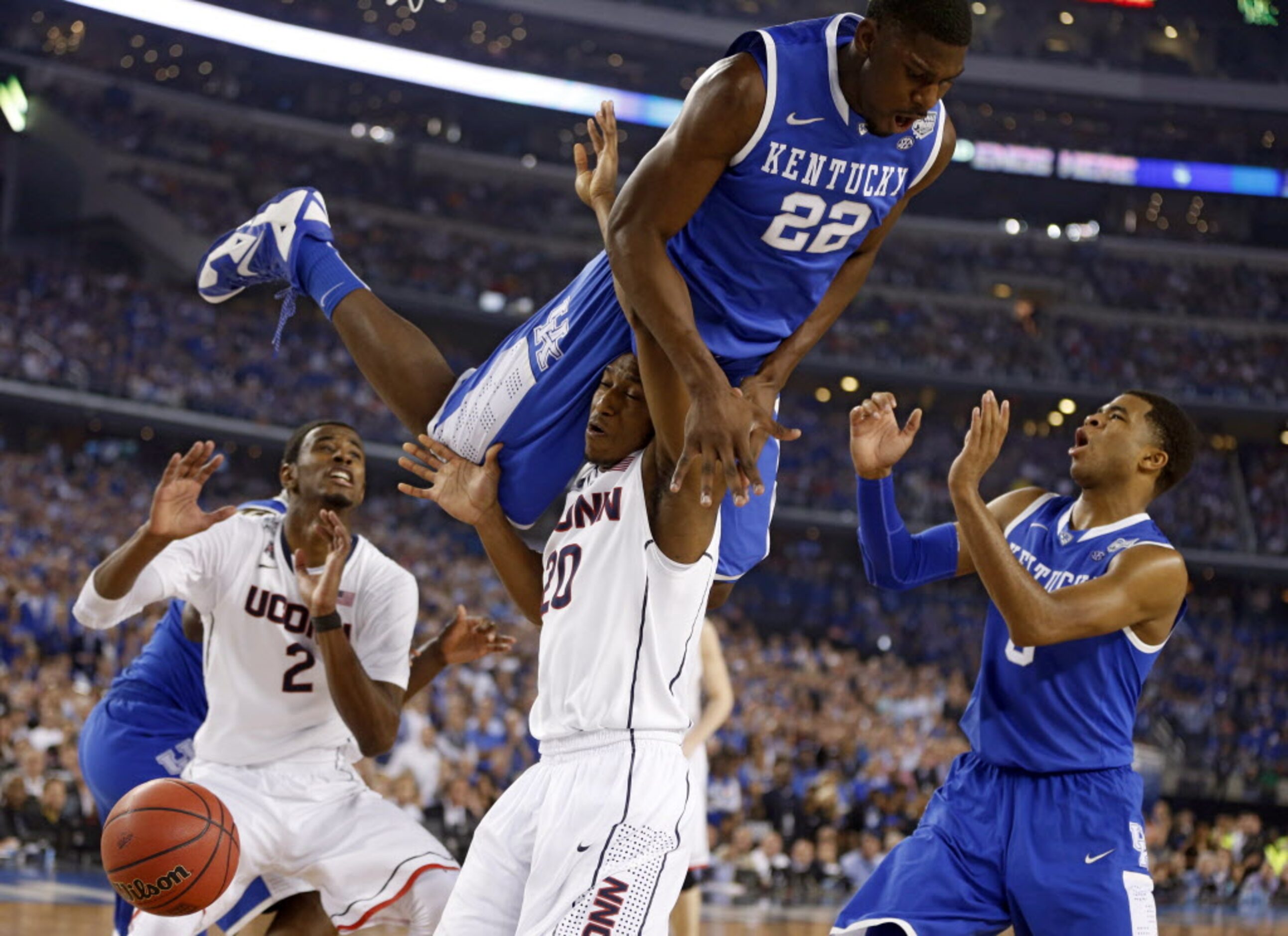 Connecticut Huskies guard/forward Lasan Kromah (20) is fouled by Kentucky Wildcats forward...