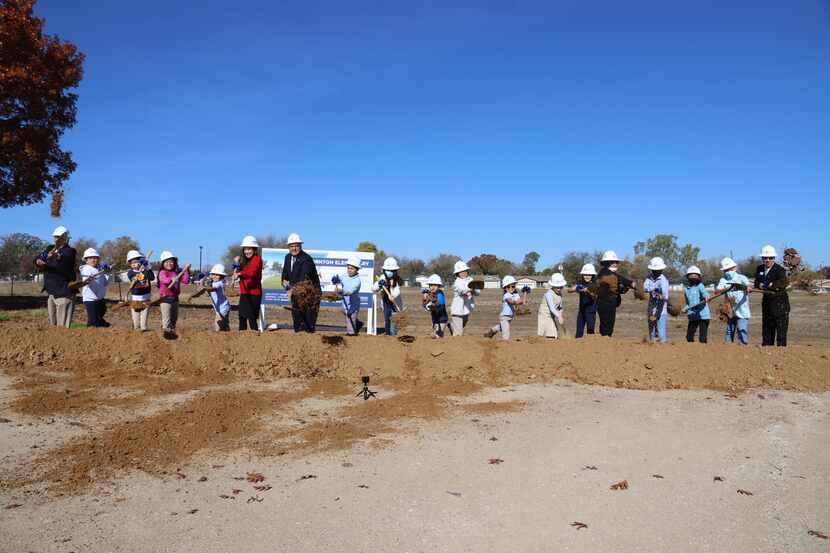 District officials and students break ground on a new building for Thornton Elementary...