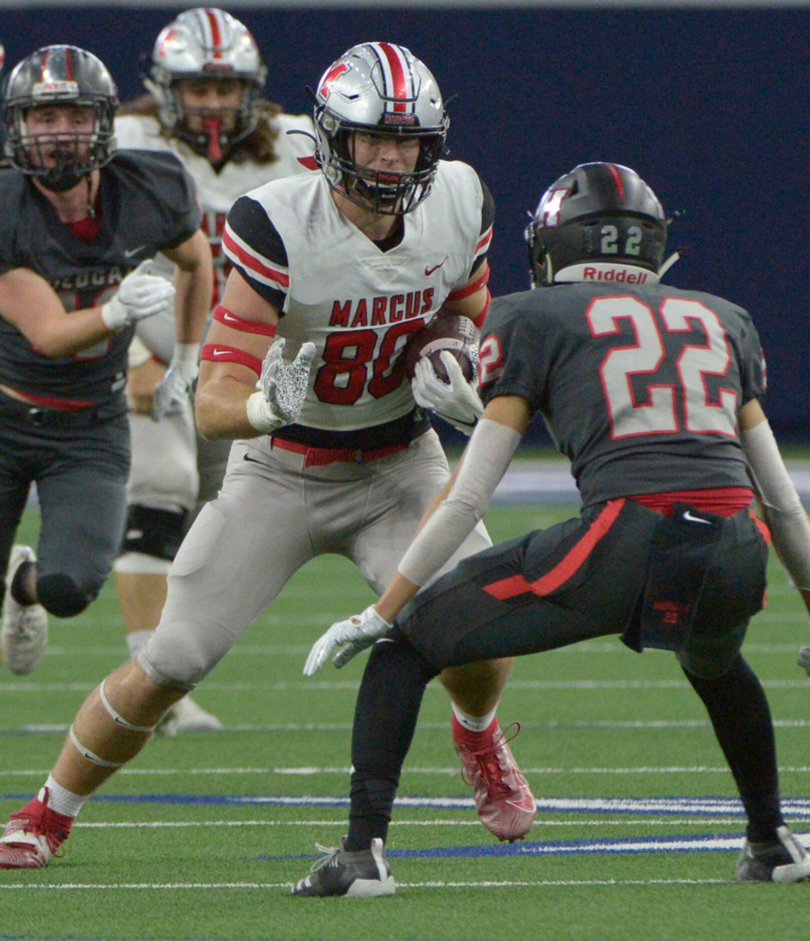 Flower Mound Marcus' Collin Sutherland (80) looks for running room as Lake Highlands Andrew...