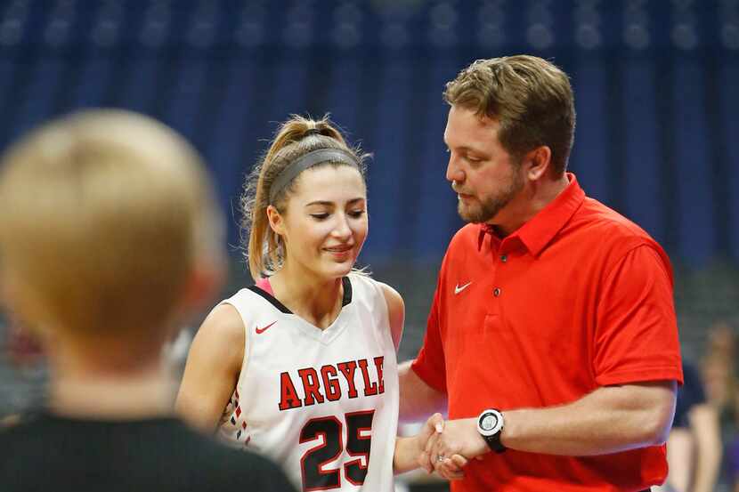 Argyle coach Chance Westmoreland congratulates Sydney Standifer in the closing seconds of a...