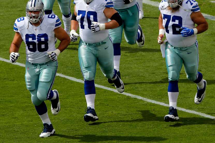 Dallas Cowboys offensive line including tackle Doug Free (68), guard Zack Martin (70),...