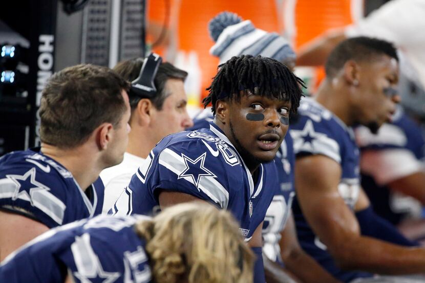 Dallas Cowboys wide receiver Noah Brown (85) talks with teammates on the bench during an NFL...