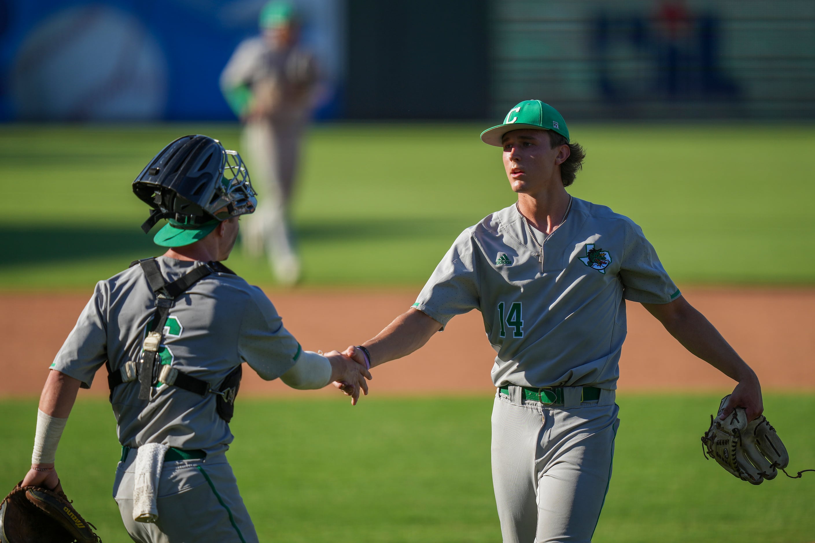 Southlake Carroll pitcher Griffin Herring shakes hands with catcher Clark Springs after the...