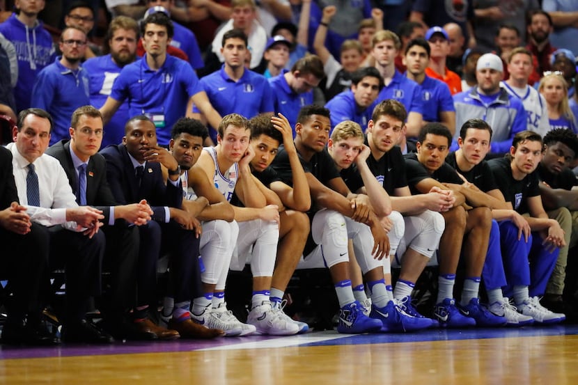 GREENVILLE, SC - MARCH 19:  The Duke Blue Devils bench reacts in the second half against the...