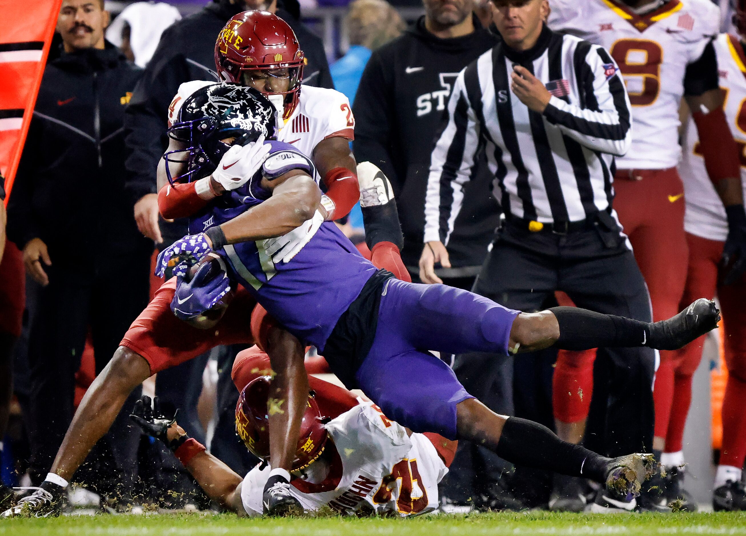 TCU Horned Frogs running back Trent Battle (17) is yanked out of bounds by Iowa State...