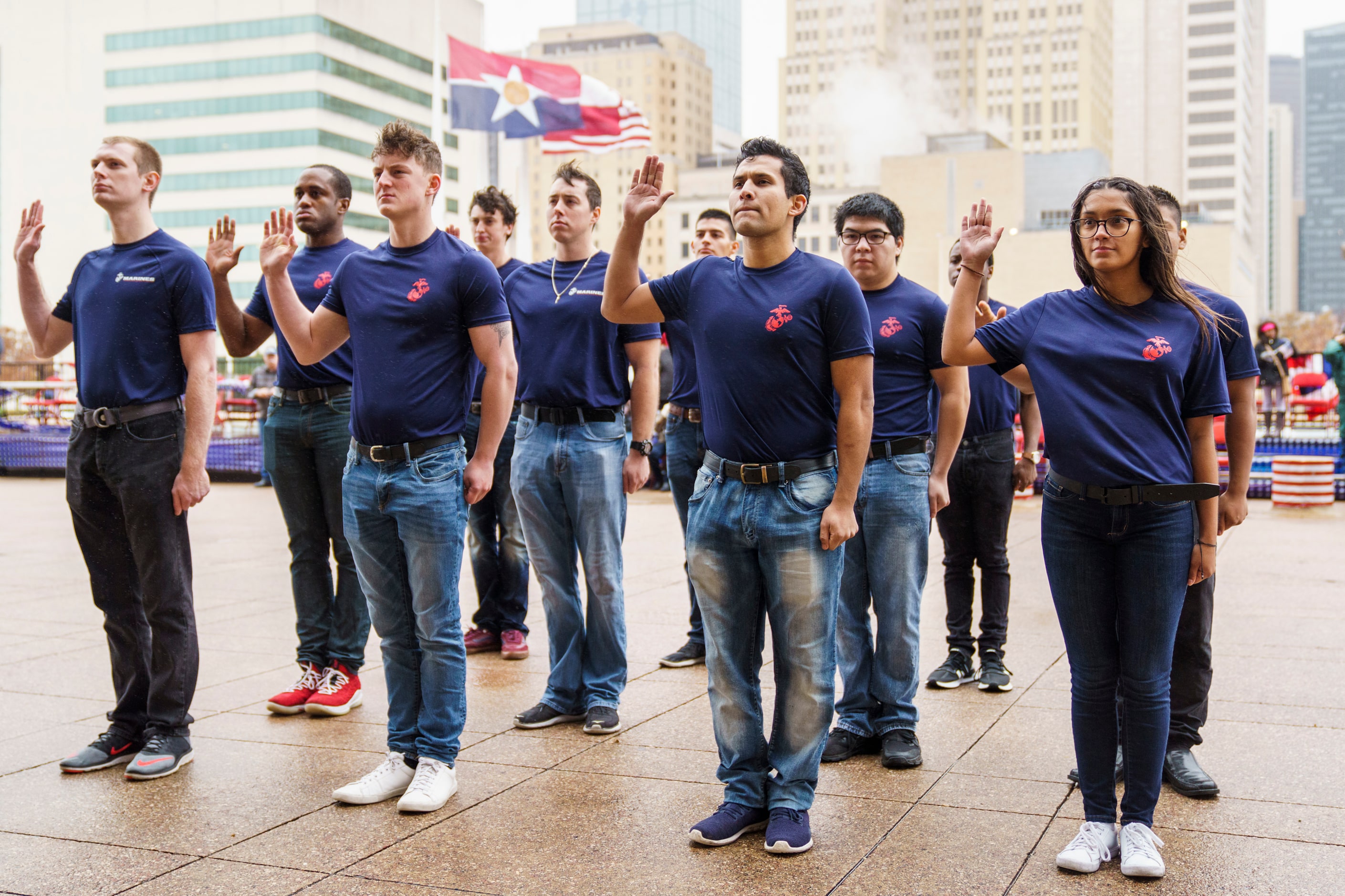 Military recruits take the Oath of Enlistment during an 11th hour ceremony at City Hall...