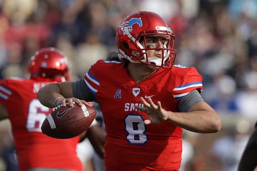 DALLAS, TX - NOVEMBER 26:  Ben Hicks #8 of the Southern Methodist Mustangs throws against...