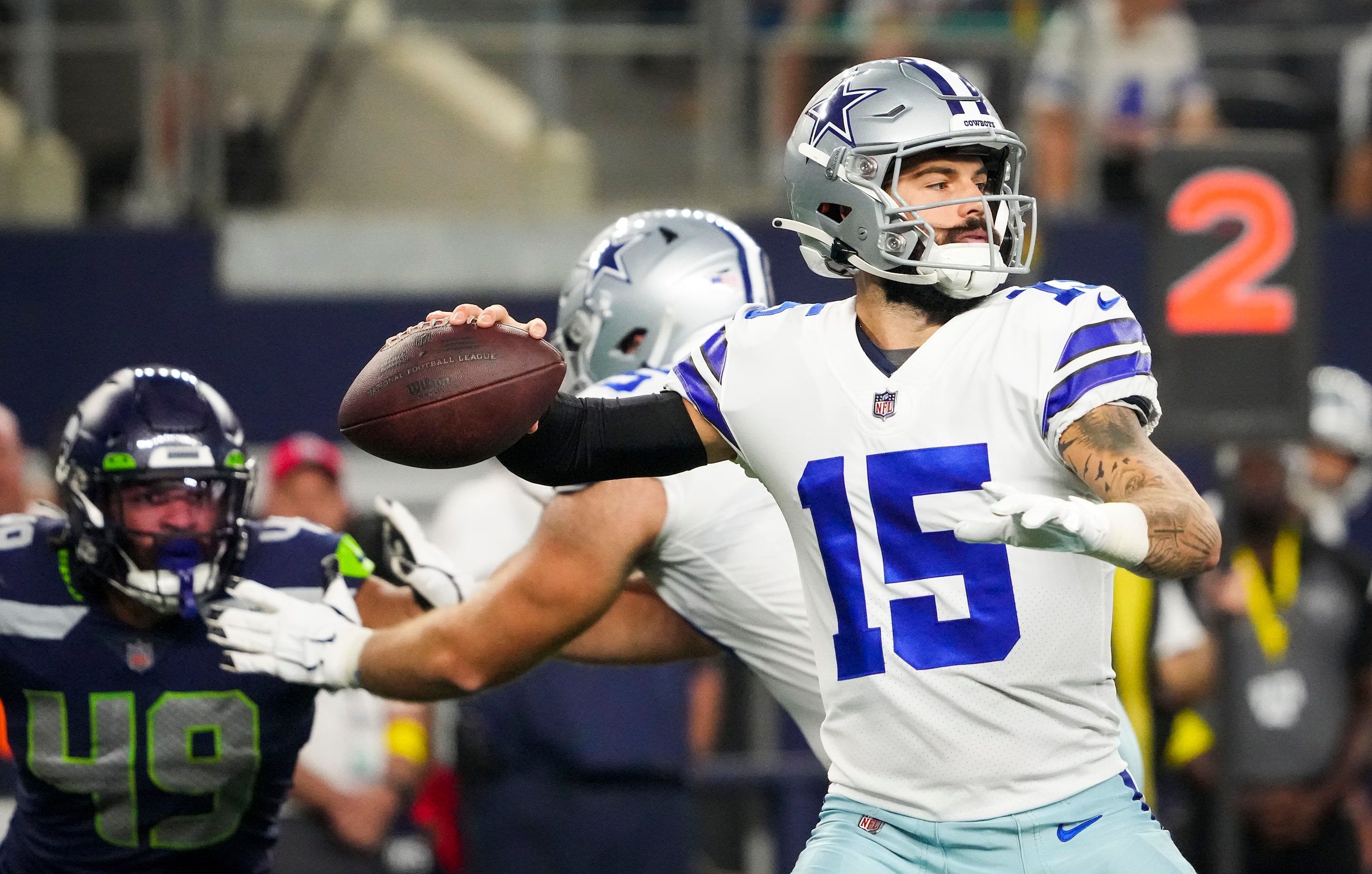 Dallas Cowboys quarterback Will Grier (15) throws a pass during the first quarter of an NFL...