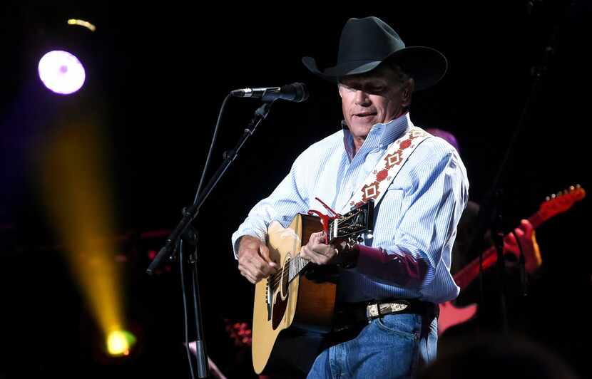  In this handout photo provided by Hand in Hand, George Strait performs onstage during...