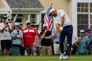 Scottie Scheffler hits from the sixth tee during the third round of the Travelers...