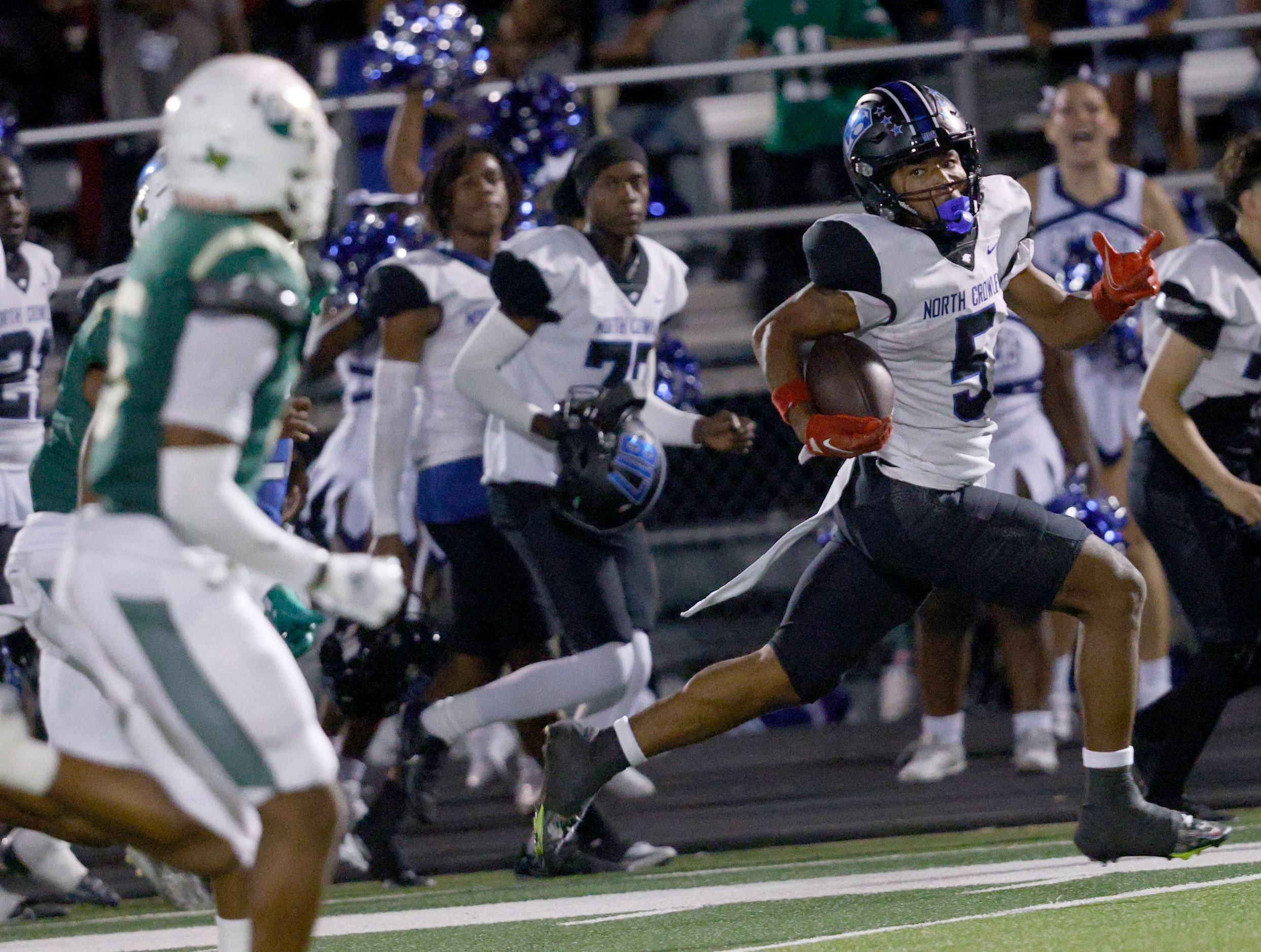 North Crowley's Daniel Bray (5) runs into the end zone for a touchdown against DeSoto during...