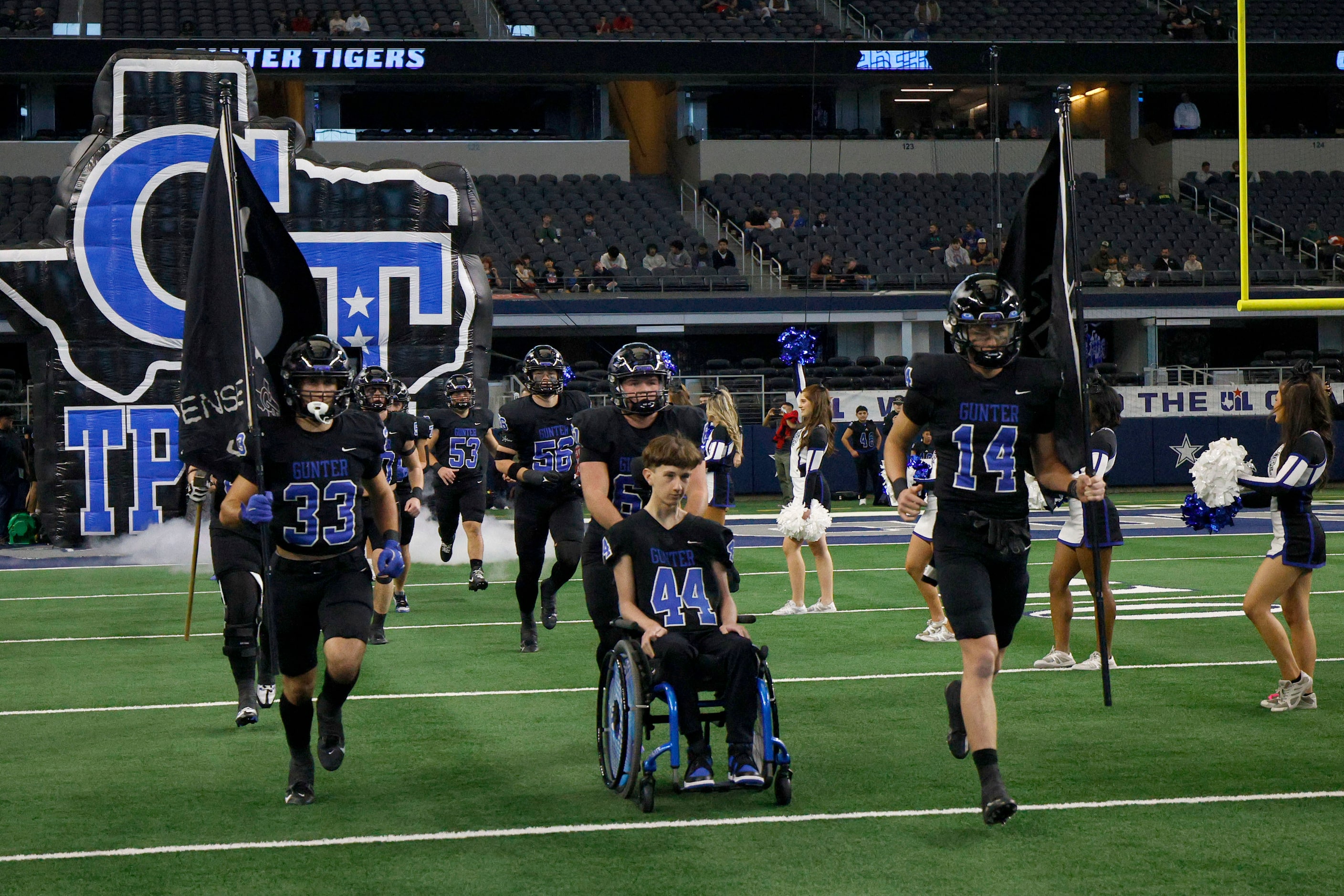 Gunter players run out to the field before the Class 3A Division II, UIL State Championship...