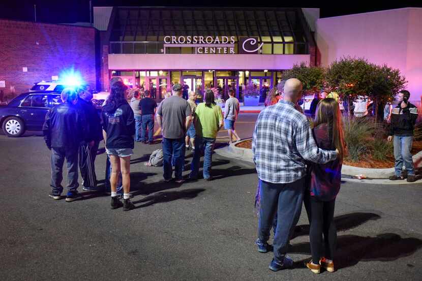 A crowd gathered near an entrance to Crossroads Center mall in St. Cloud, Minn., on Saturday...