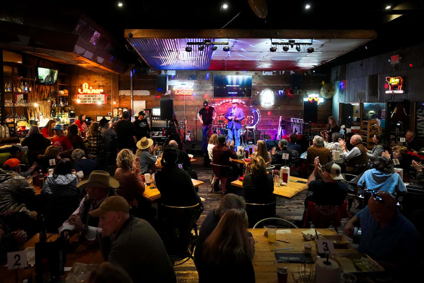 Lee Wells addresses the crowd during a benefit concert at Sideways BBQ on Monday, March 18,...