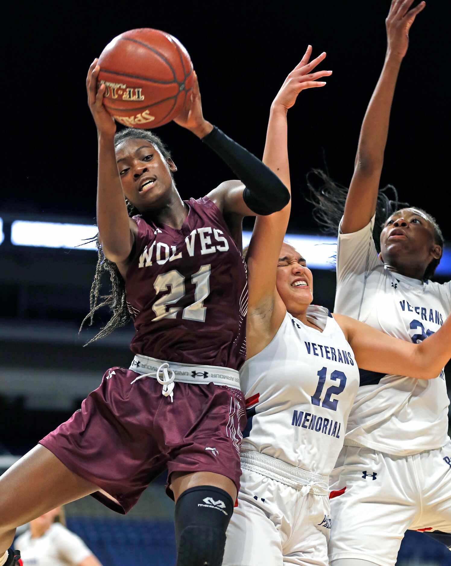 Mansfield Timberview Forward Stephanie Mosley #21 grabs a rebound away from Veterans...