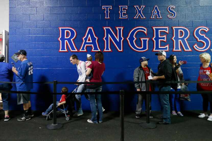 Rangers fans stand in line to have an opportunity to take their pictures take with Rangers...