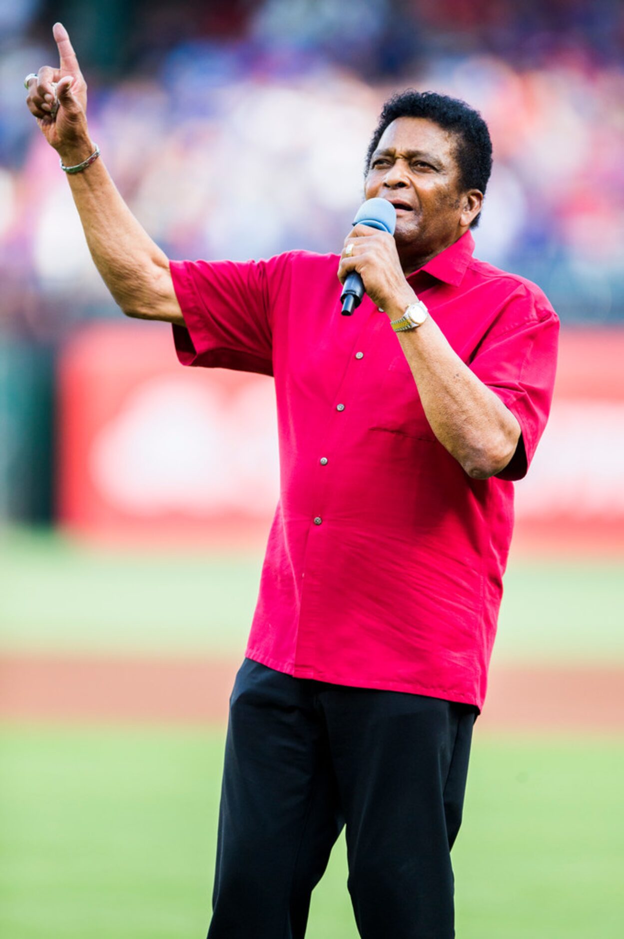 Charlie Pride sings the national anthem before an MLB game between the Texas Rangers and the...