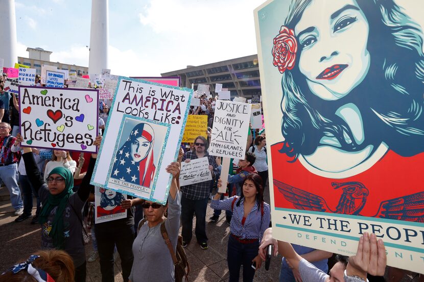 More than 1,500 people rallied in downtown Dallas in a peaceful show of support for...