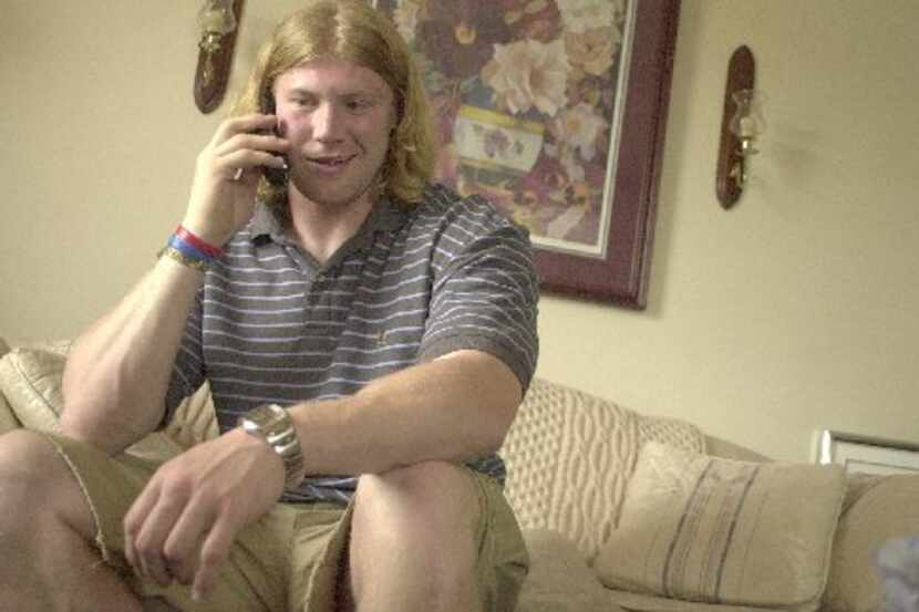 Bobby Carpenter, 22, of Lancaster, takes a conference call with the Dallas Cowboys media...