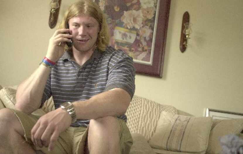 Bobby Carpenter, 22, of Lancaster, takes a conference call with the Dallas Cowboys media...