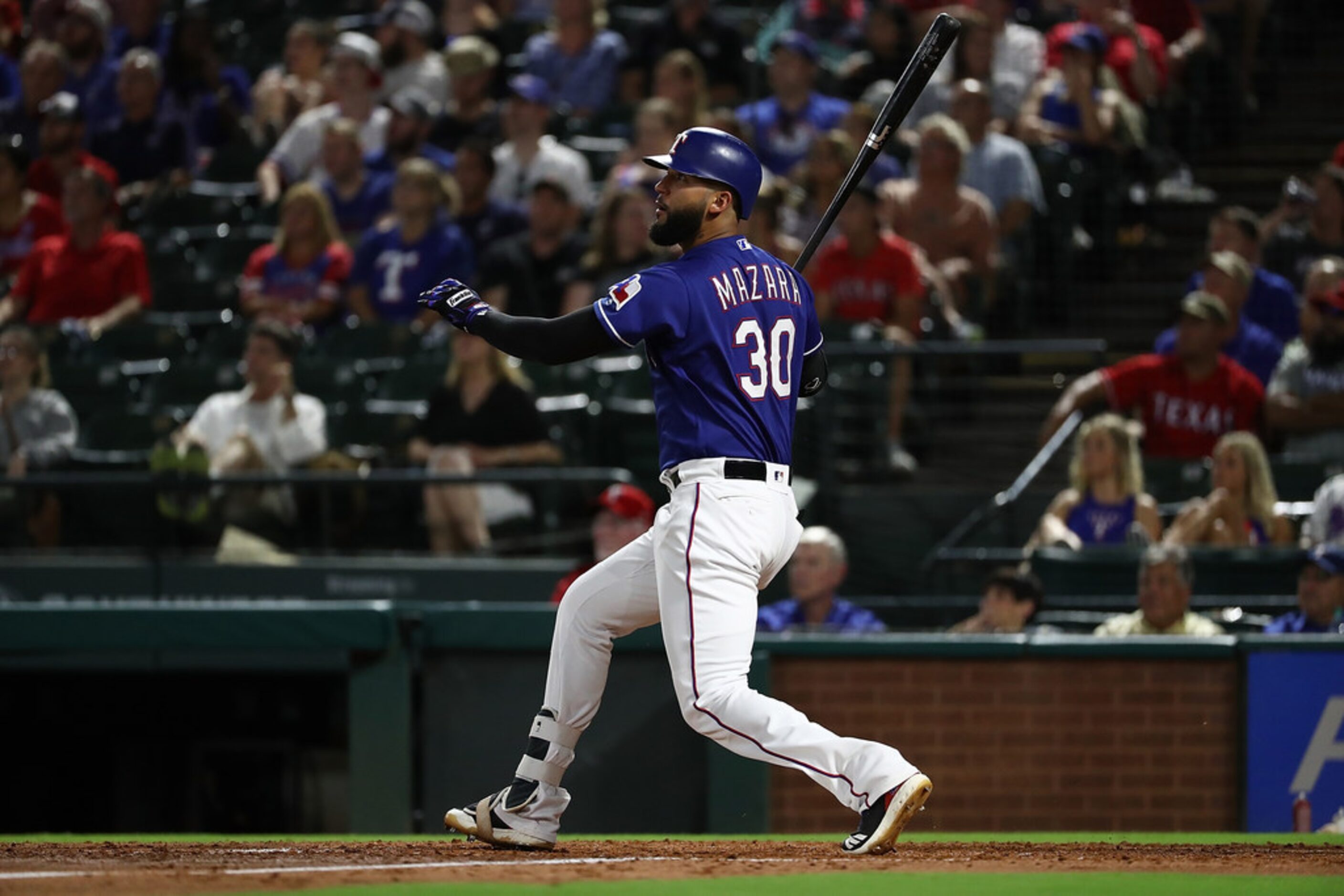 ARLINGTON, TX - SEPTEMBER 04:  Nomar Mazara #30 of the Texas Rangers hits a two run double...