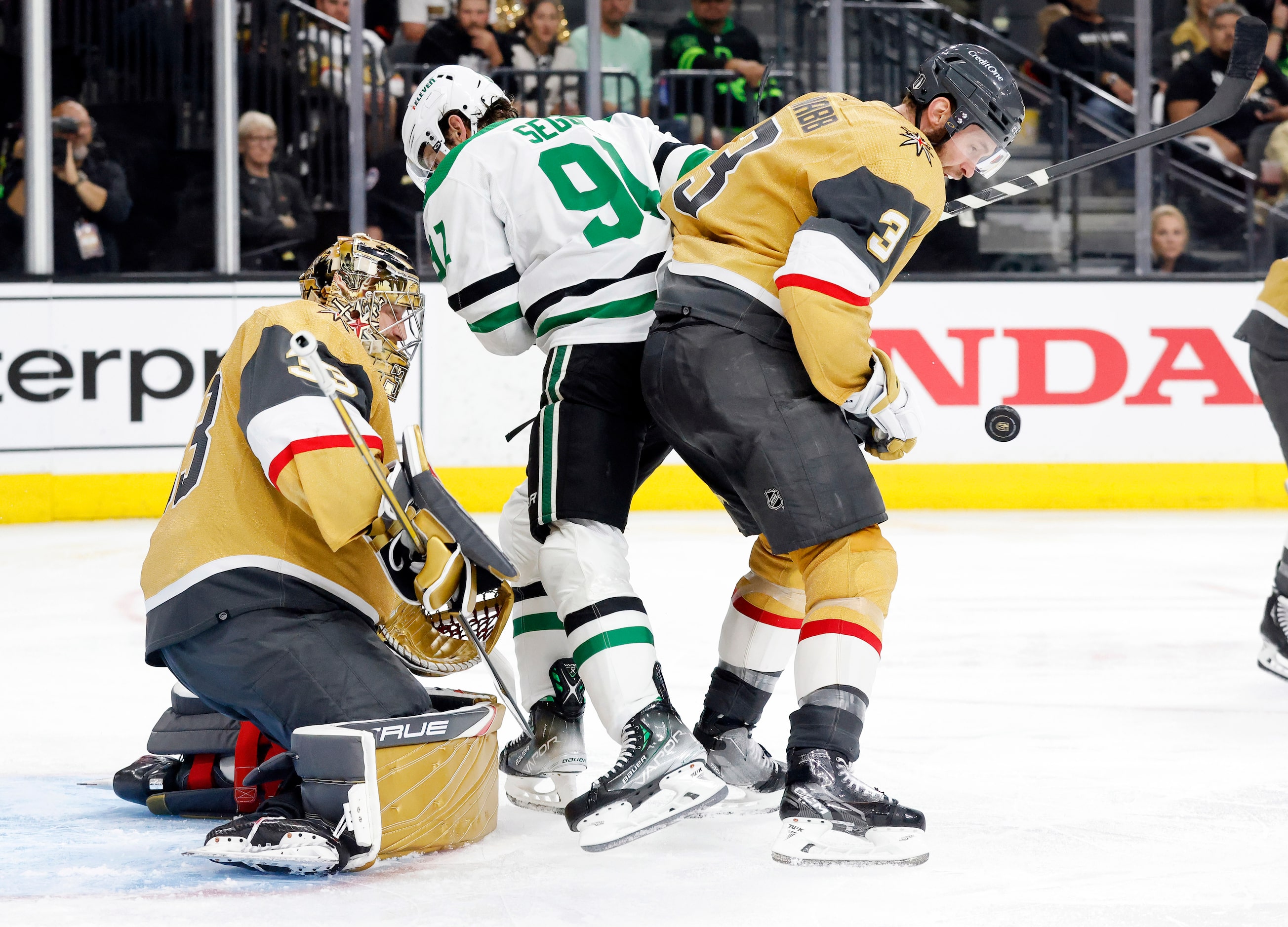 The puck bounces off of Vegas Golden Knights defenseman Brayden McNabb (3) as Dallas Stars...