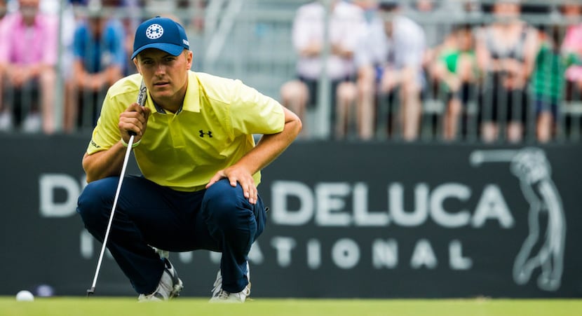 Jordan Spieth lines up a putt on the 17th green during round four of the Dean & Deluca...