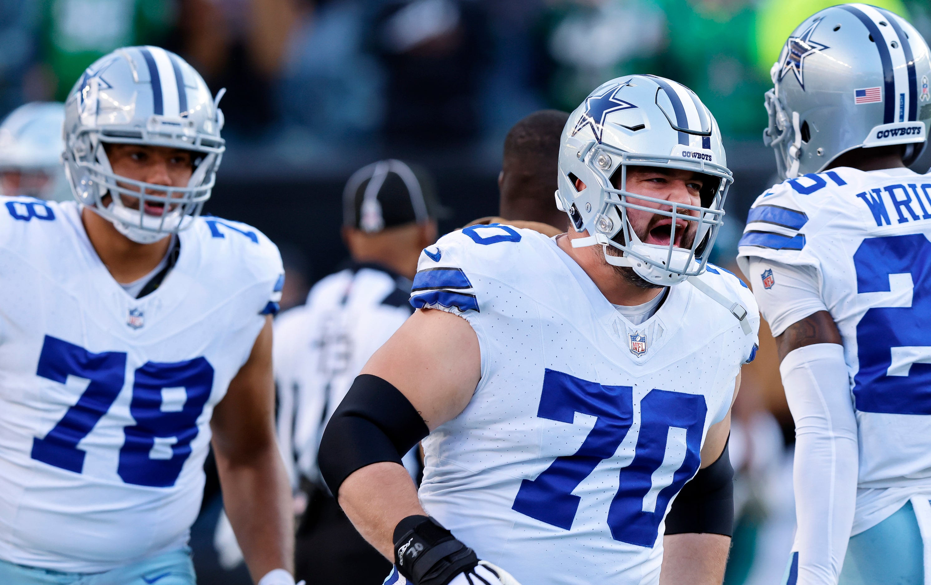 Dallas Cowboys guard Zack Martin (70) and the offense are fired up during pregame warmups...