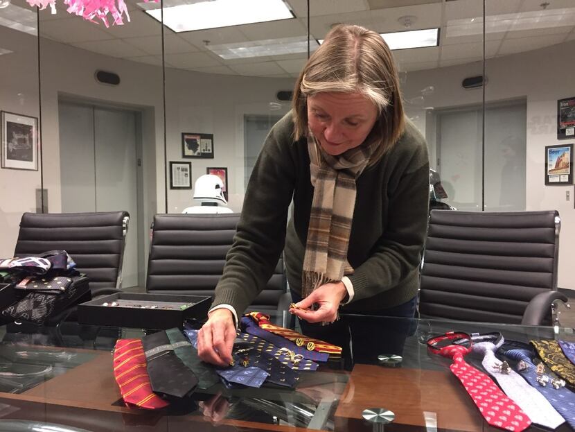 Cufflinks Inc. co-president Patty Bentley arranges Harry Potter men's and boy's accessories...