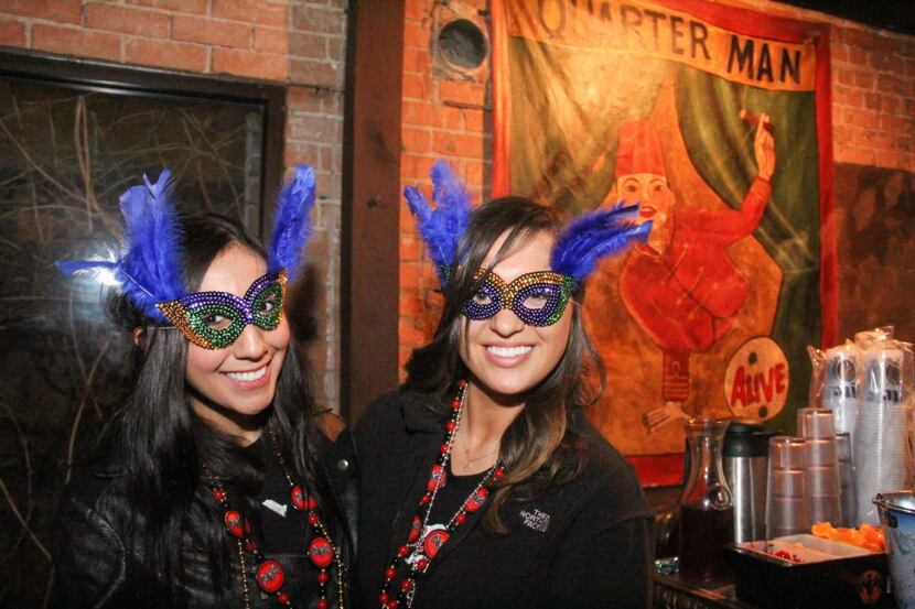 Tanya Lugo and Laura Perez attended The Quarter Bar's Mardi Gras party.