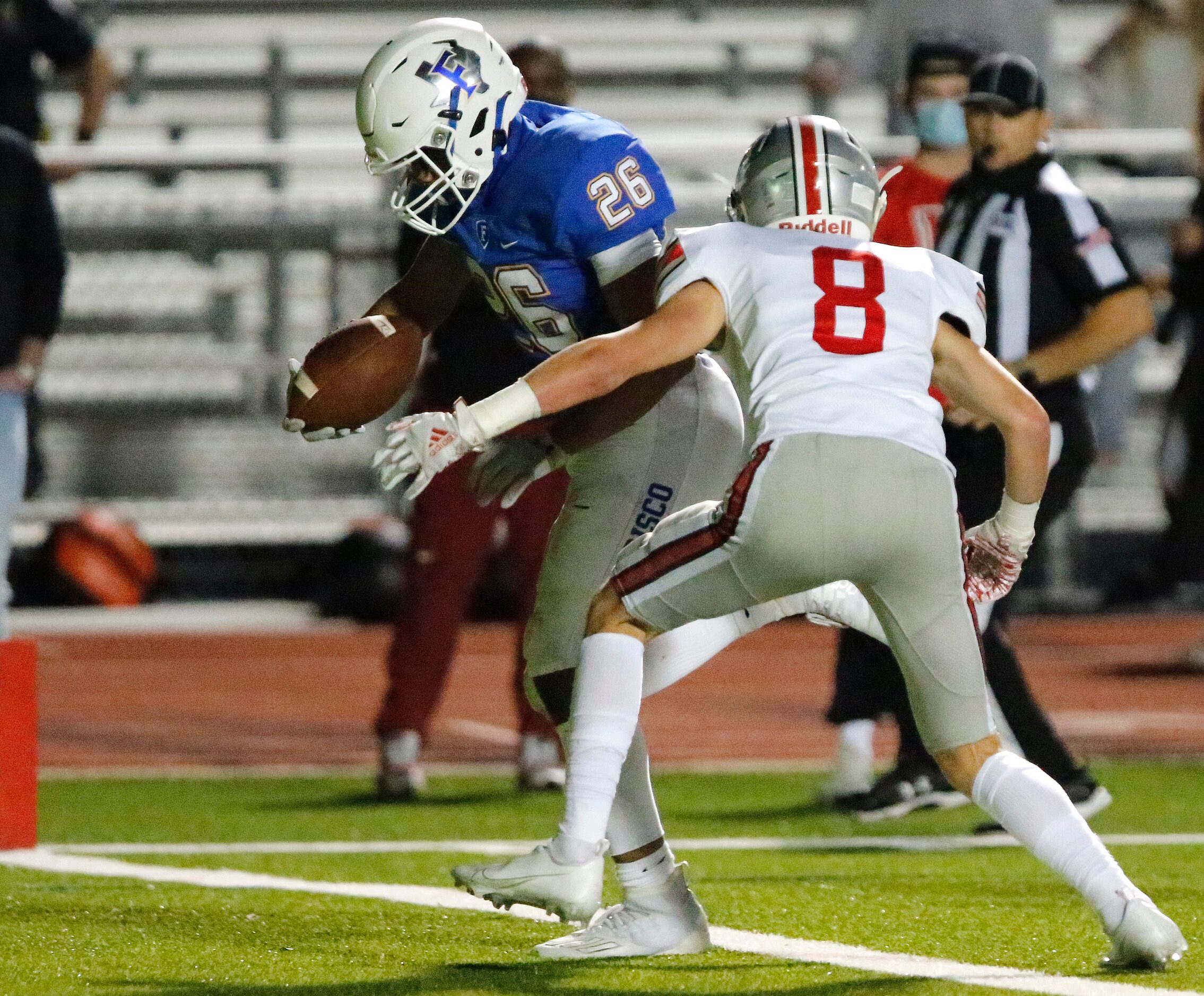 Frisco High School running back Syone Usma-Harper (26) gets past Lovejoy High School...