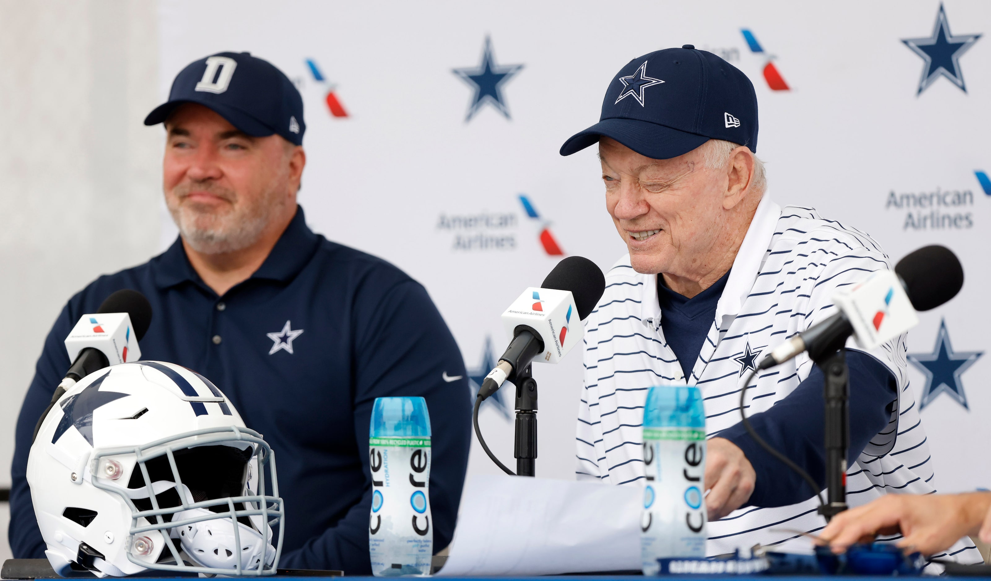 Dallas Cowboys owner Jerry Jones gives a wink to he media as he and head coach Mike McCarthy...