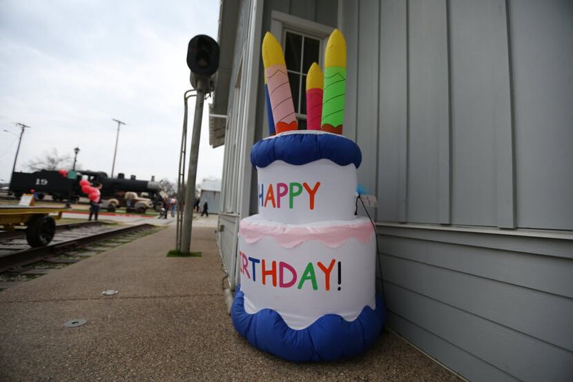  An inflated cake marks the celebration during Frisco's 113th birthday at the Frisco...