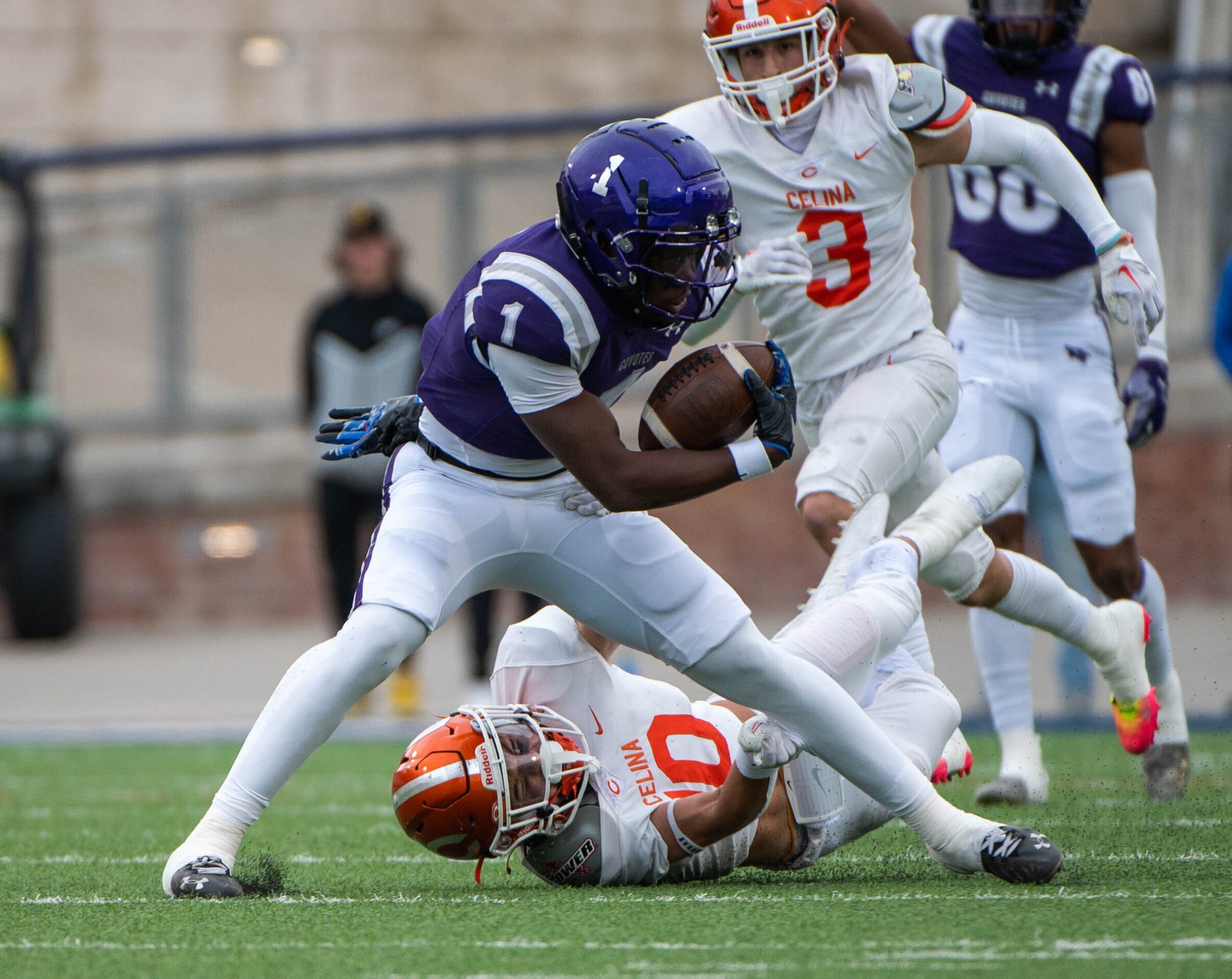 Anna’s running back Breezy Dubar (1) runs past Celina’s Cade Biagini (10) in the first half...