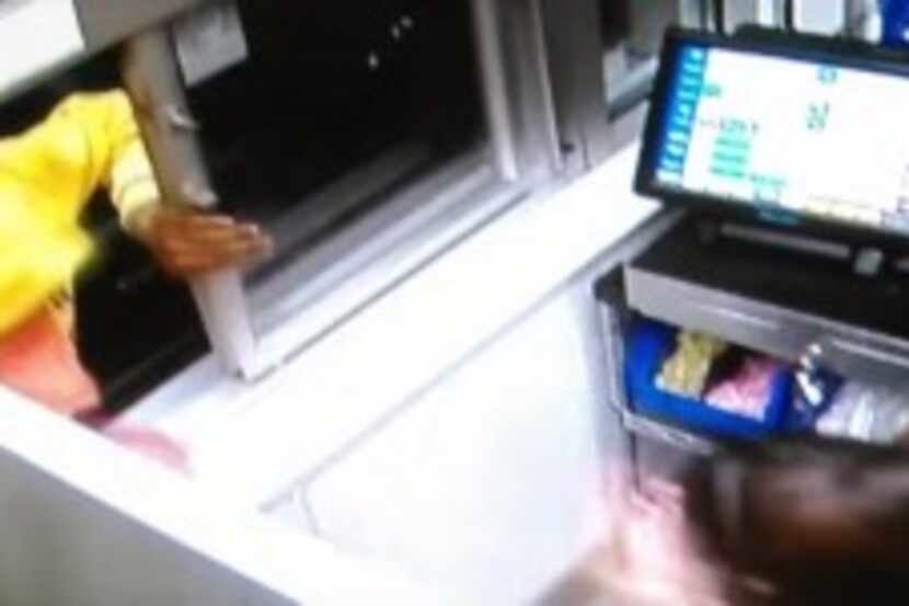  The man seen jumping through this drive-thru window told police he was part of this...
