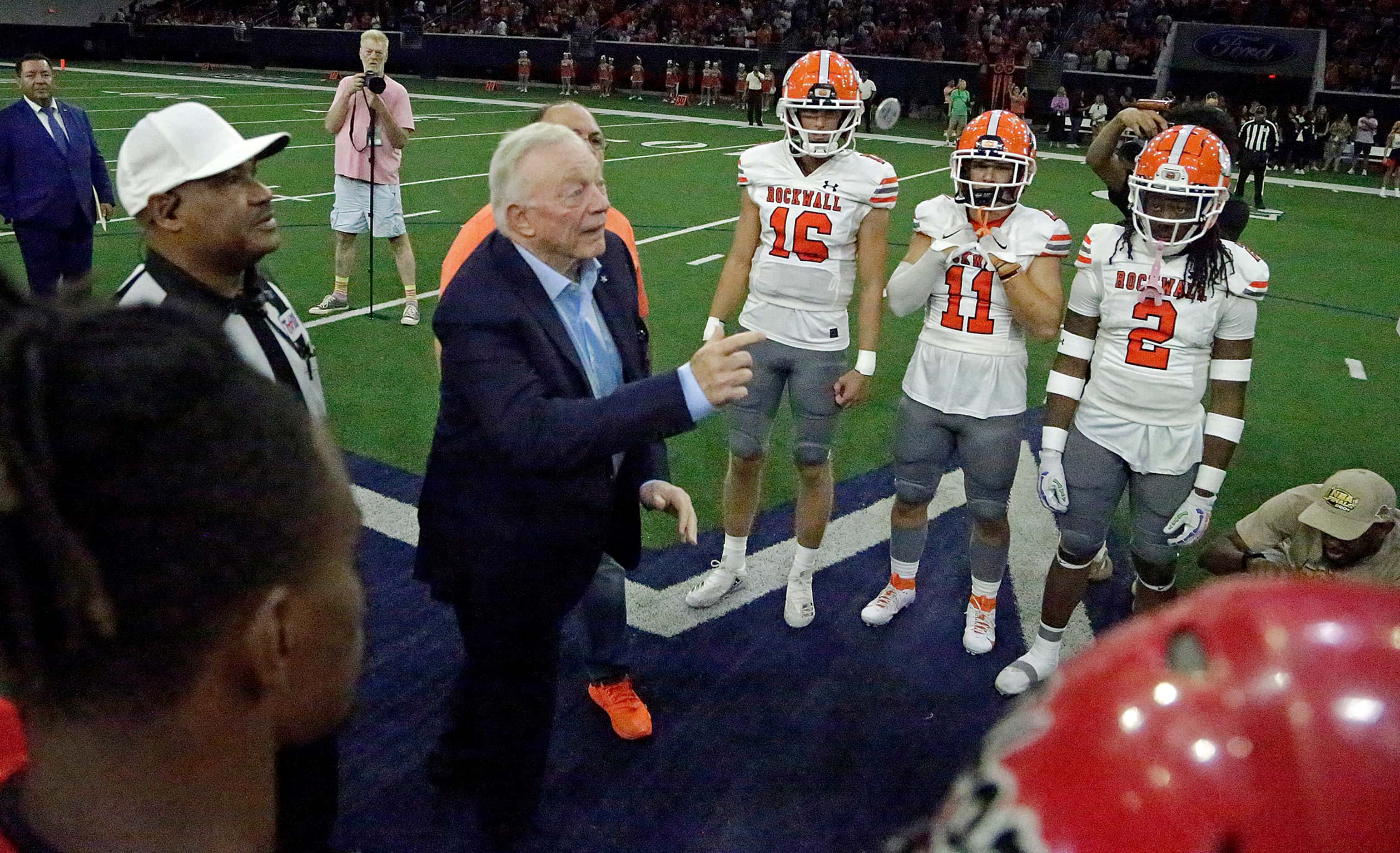 Cowboys owner Jerry Jones flips the coin to determine first posession before the kickoff of...
