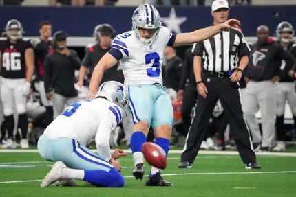 Dallas Cowboys kicker Lirim Hajrullahu kicks an extra point during the first half of an NFL...