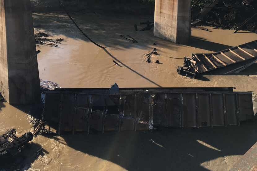 Five Union Pacific train cars fell into Denton Creek on Sunday after a derailment. 