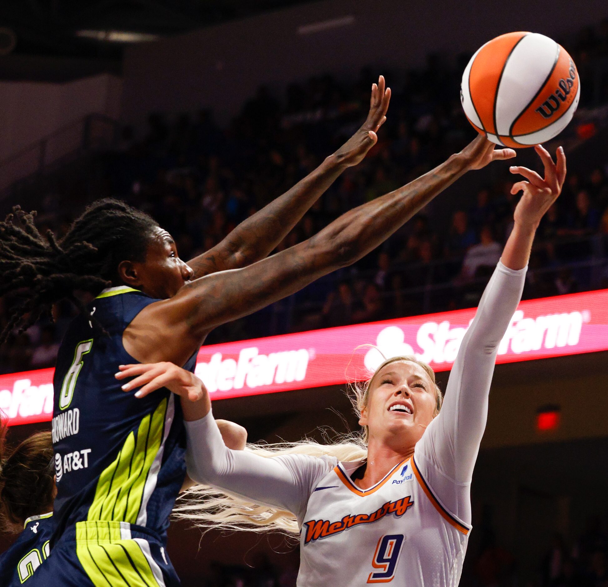 Dallas Wings forward Natasha Howard (6) blocks a shot attempt from Phoenix Mercury guard...