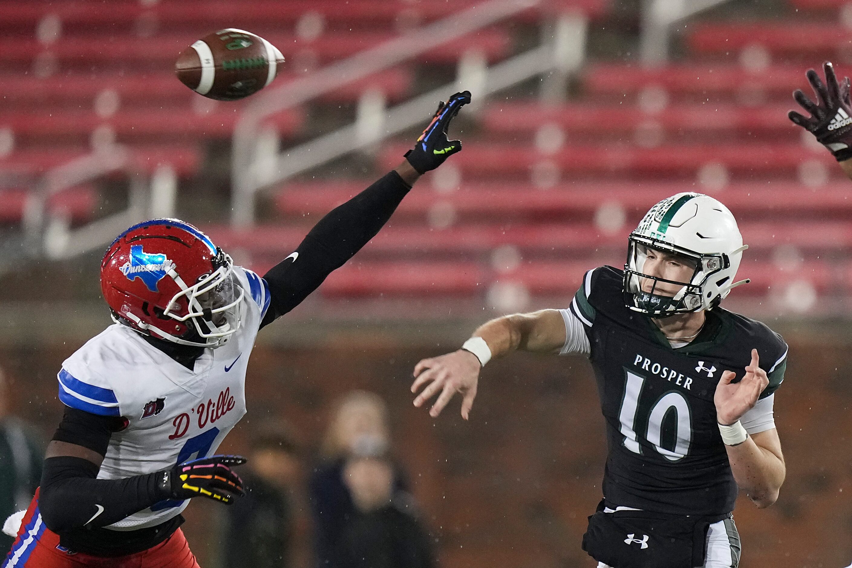 Prosper quarterback Harrison Rosar (10) throws a pass under pressure from Duncanville...