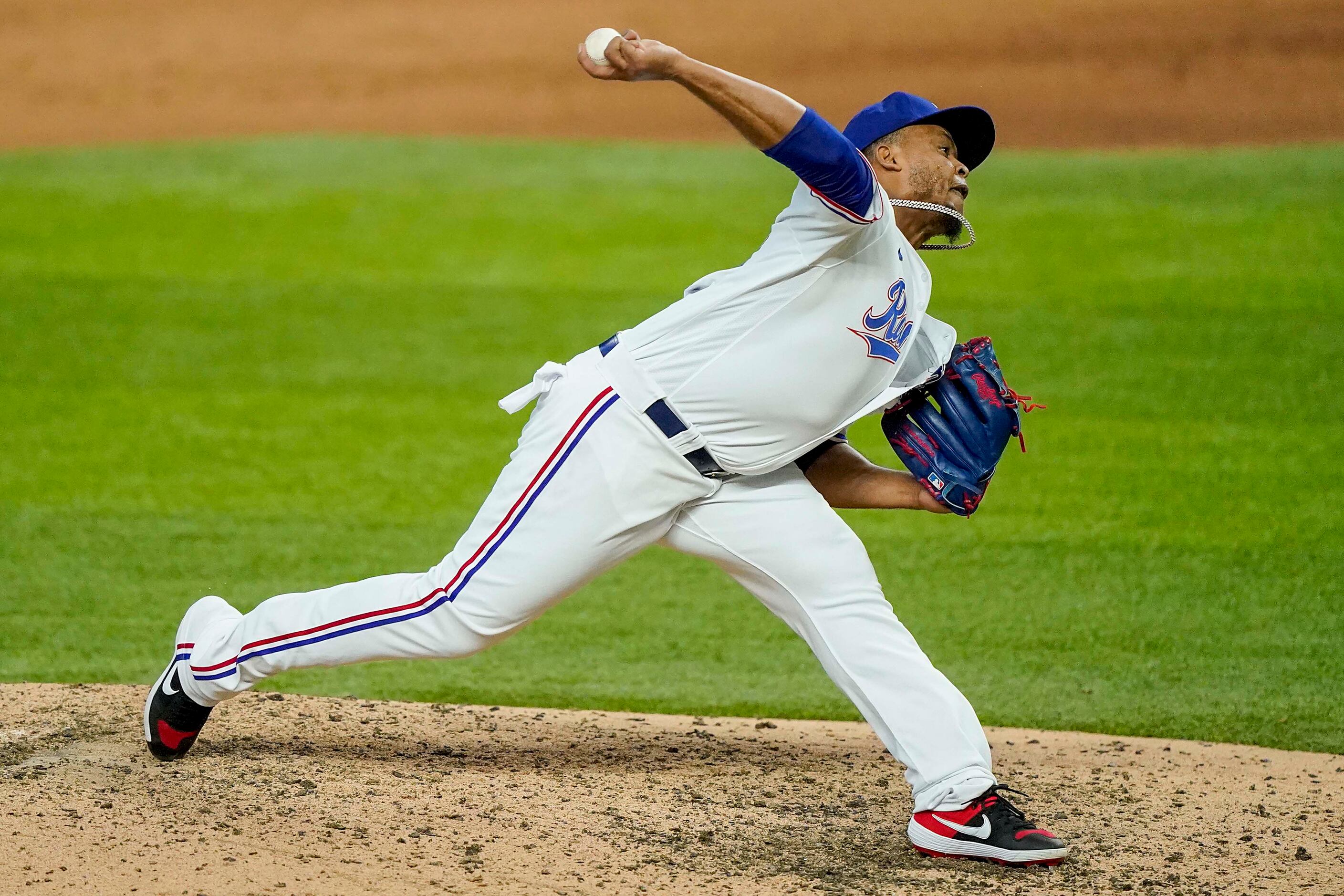 Texas Rangers pitcher Edinson Volquez pitches during the ninth inning against the Colorado...