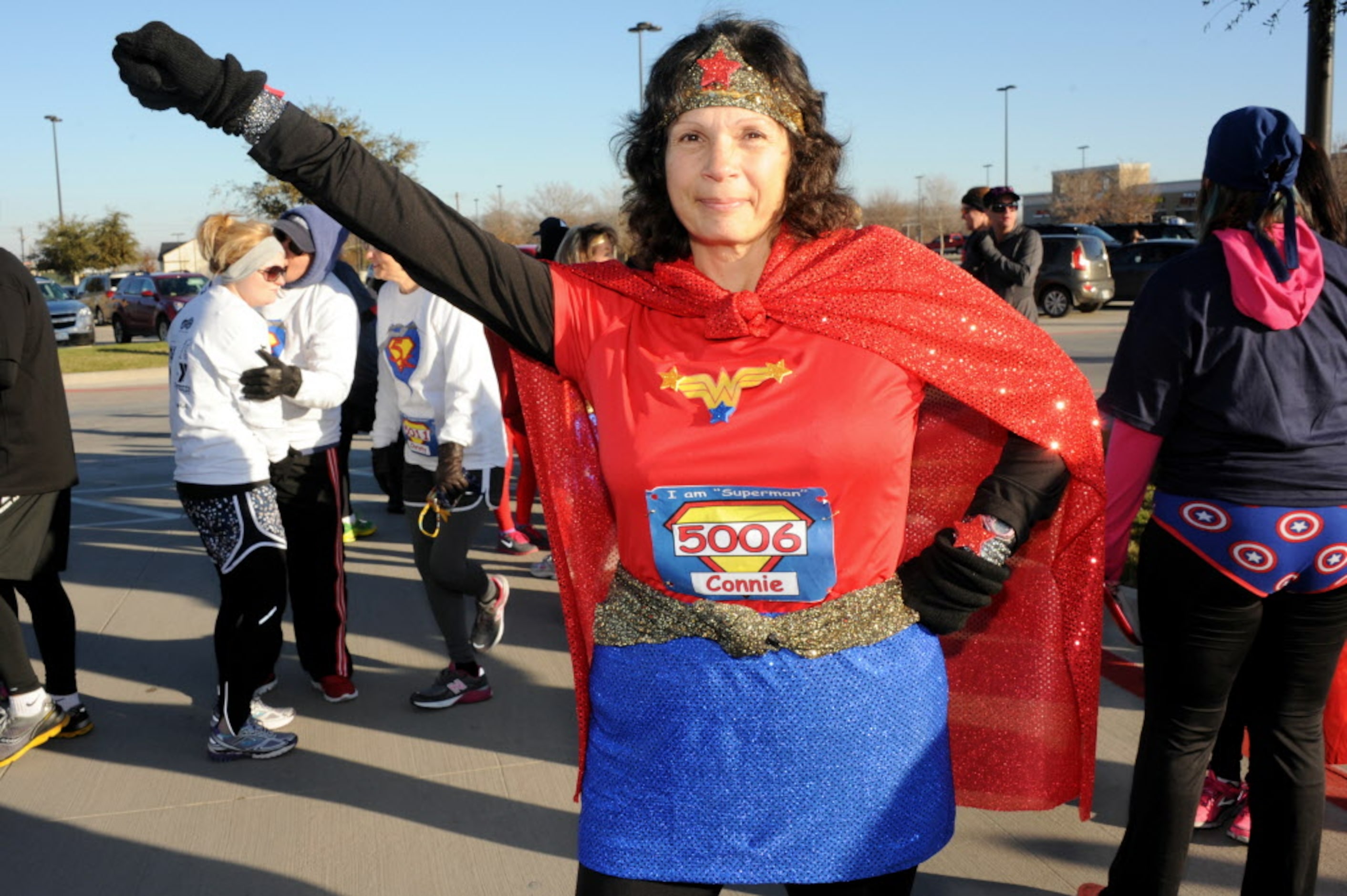 Wonder Woman Connie Turpin psychs herself up before the Superman 5k Run at Caruth Lake Park...