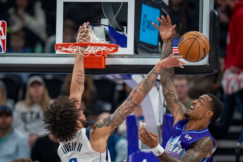 Dallas Mavericks center Dereck Lively II, blocks a shot by Utah Jazz forward John Collins,...