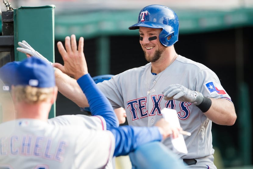CLEVELAND, OH -  MAY 31: Bryan Holaday #8 of the Texas Rangers celebrates after a hitting a...