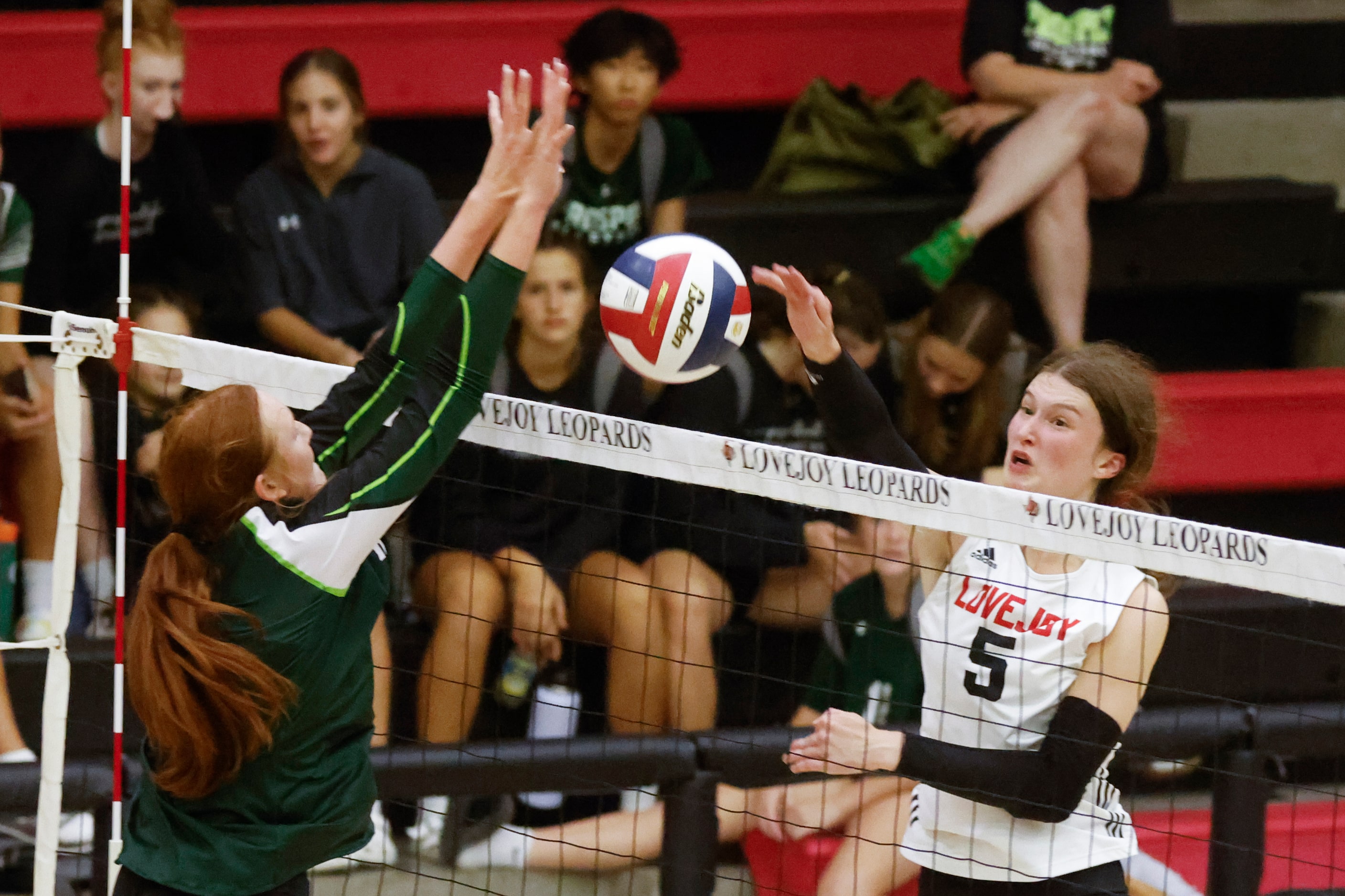 Lovejoy’s Morgan VanVoorhis, right, digs past Prosper’s Ella Chaney during a season-opening...