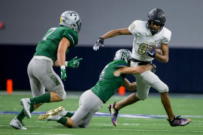 The Colony wide receiver Keith Miller (88) gets tackled by Frisco Reedy defensive back...