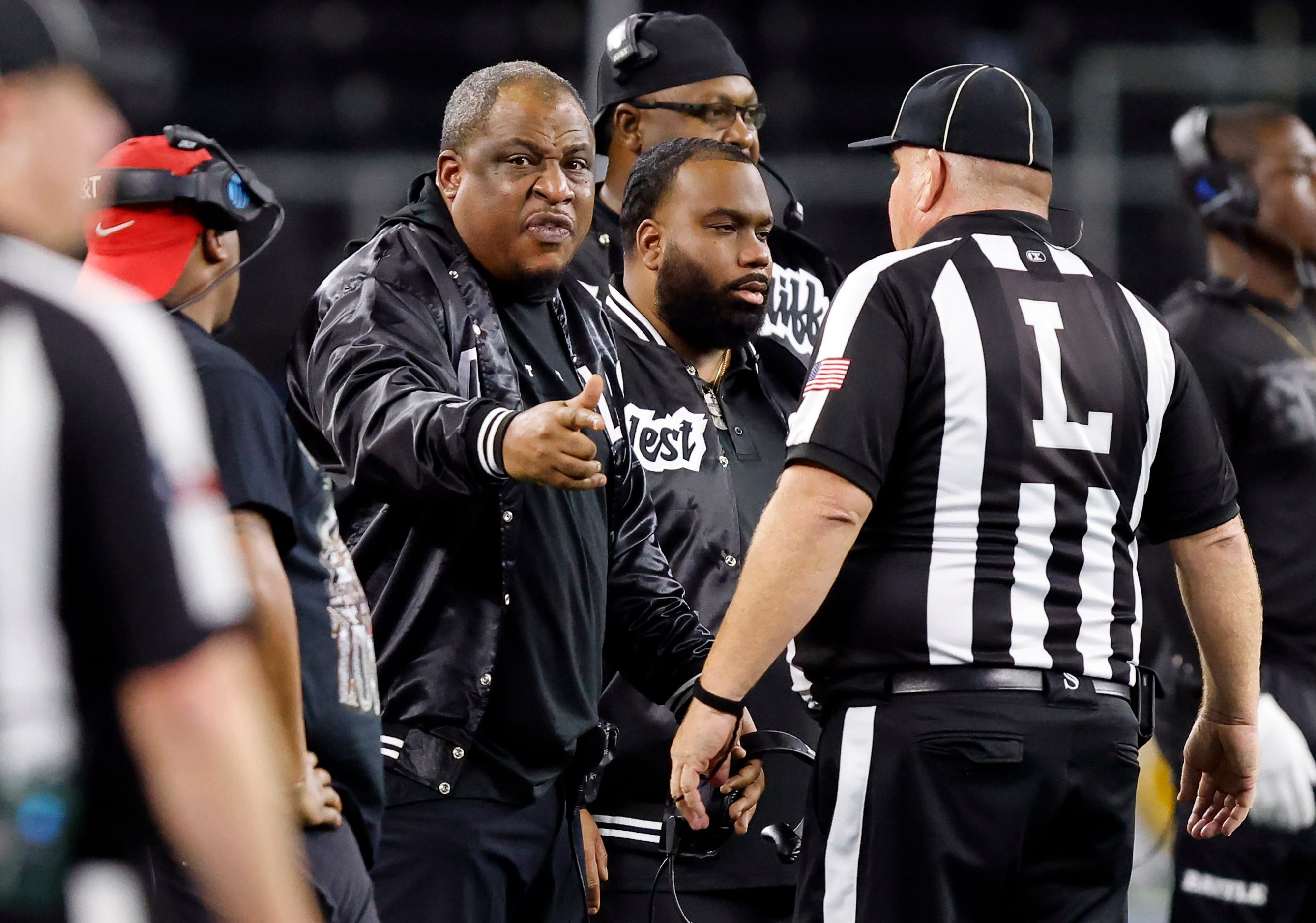 South Oak Cliff head coach Jason Todd (center) argues a call in the first half against Port...