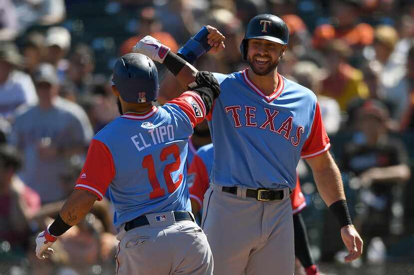SAN FRANCISCO, CA - AUGUST 25:  Rougned Odor #12 and Joey Gallo #13 of the Texas Rangers...